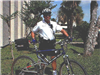 officer poses with bike