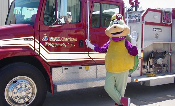 The Wally Wise safety mascot with a fire truck