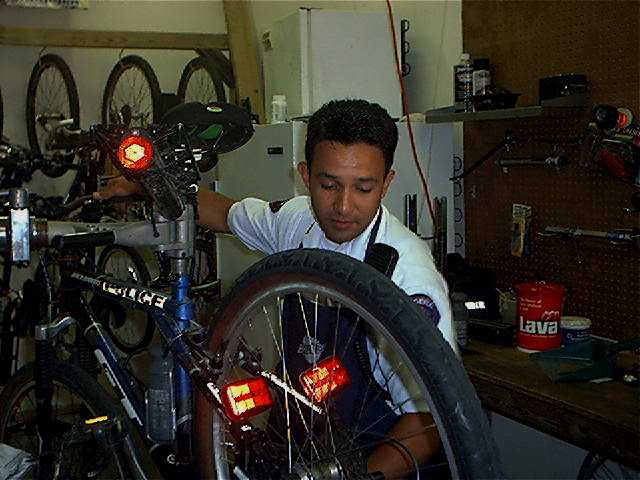 bike officer fixes bike