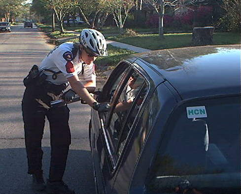 bike officer speaks to vehiclist