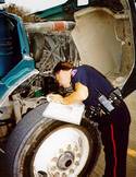 Worker inspects vehicle
